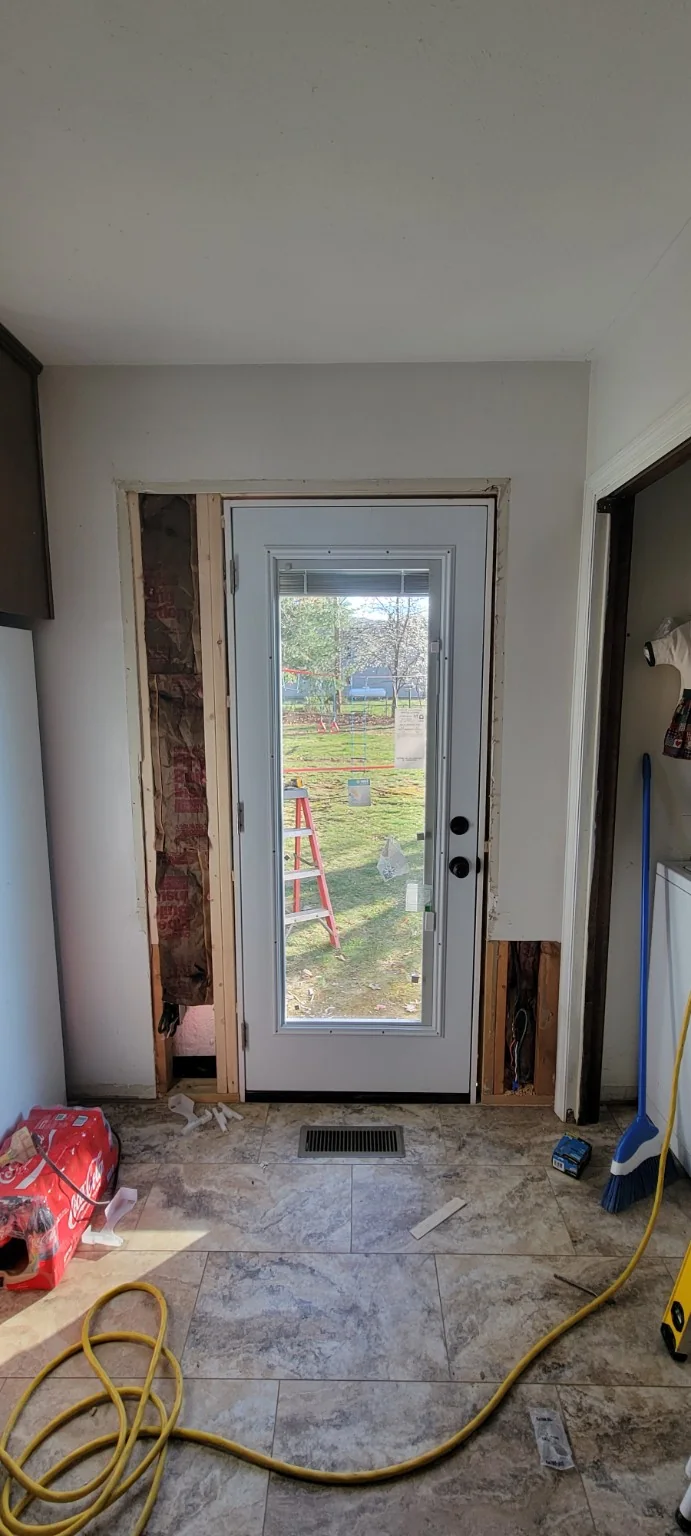 New exterior door installed in a modified wall opening